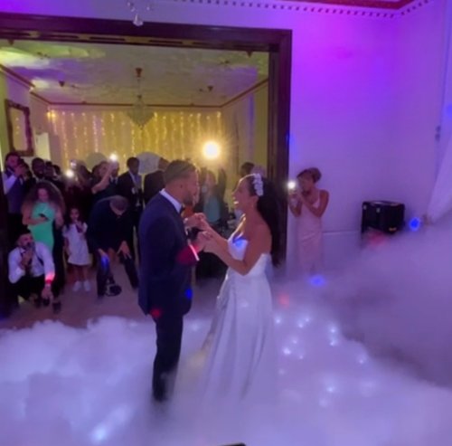 1 Bride and groom's first dance surrounded by a dry ice cloud effect at their wedding reception