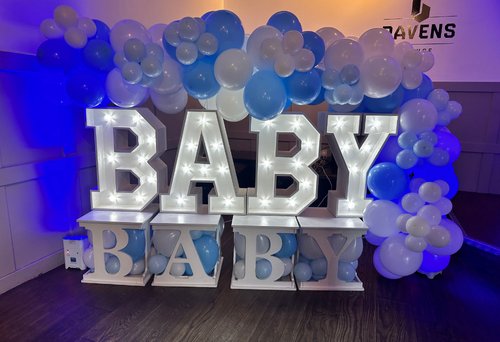 2 Light-up 10 numbers with pastel balloon garland on stage for a 10th birthday party