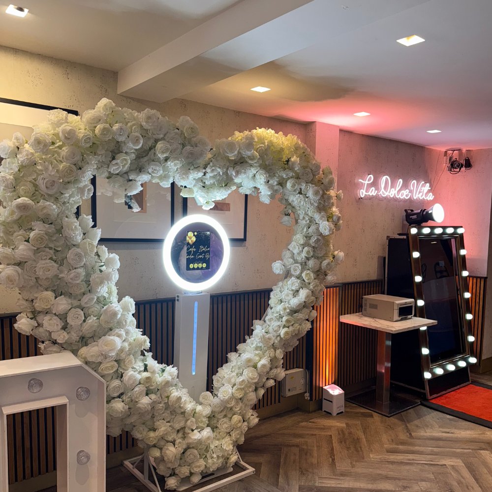 2 Flower wall photobooth with heart-shaped floral frame and ring light mirror booth at a London Event DJs event