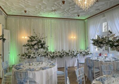 Green uplighting at Highley Manor West Sussex wedding venue