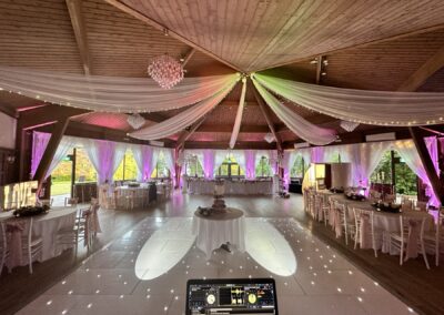 DJ booth view of the dancefloor and light-up LOVE letters at a Ravenswood wedding reception