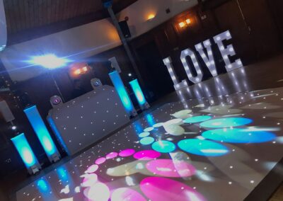 DJ setup with LED starlit dancefloor at Ravenswood, Sharpthorne West Sussex — London Event DJs